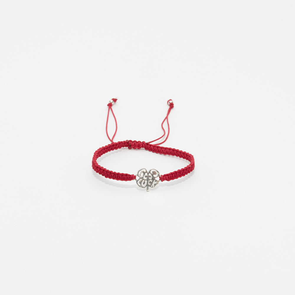 Pulsera tejida good Luck con dije en plata